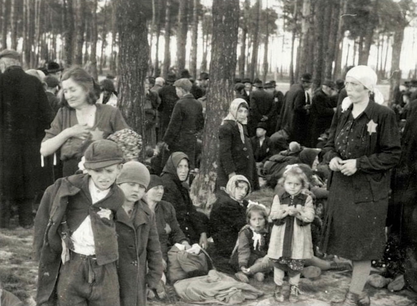 women and children waiting in the woods